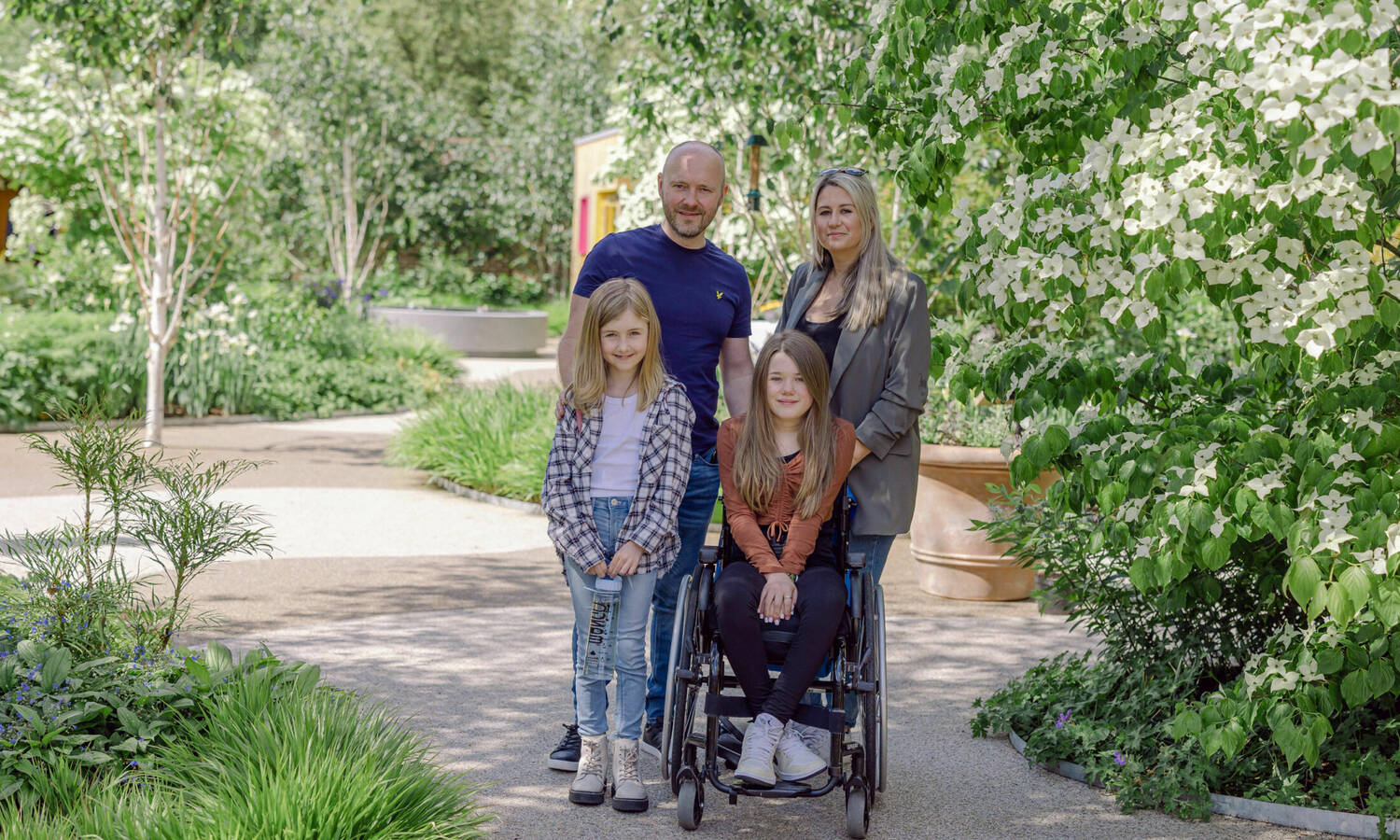 Young patient with family in Horatios Garden London South East at the Royal National Orthopaedic Hospital Stanmore Bizzy Arnott